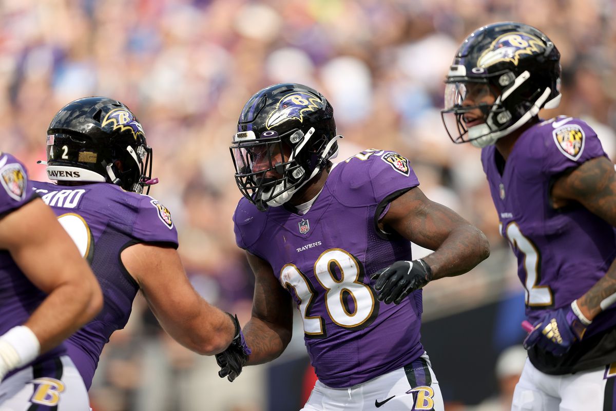 Latavius Murray #28 of the Baltimore Ravens celebrates a touchdown with Patrick Ricard #42 of the Baltimore Ravens during the first quarter against the Los Angeles Chargers at M&amp;T Bank Stadium on October 17, 2021 in Baltimore, Maryland.