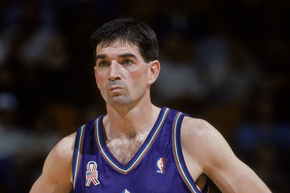 John Stockton stands on the court