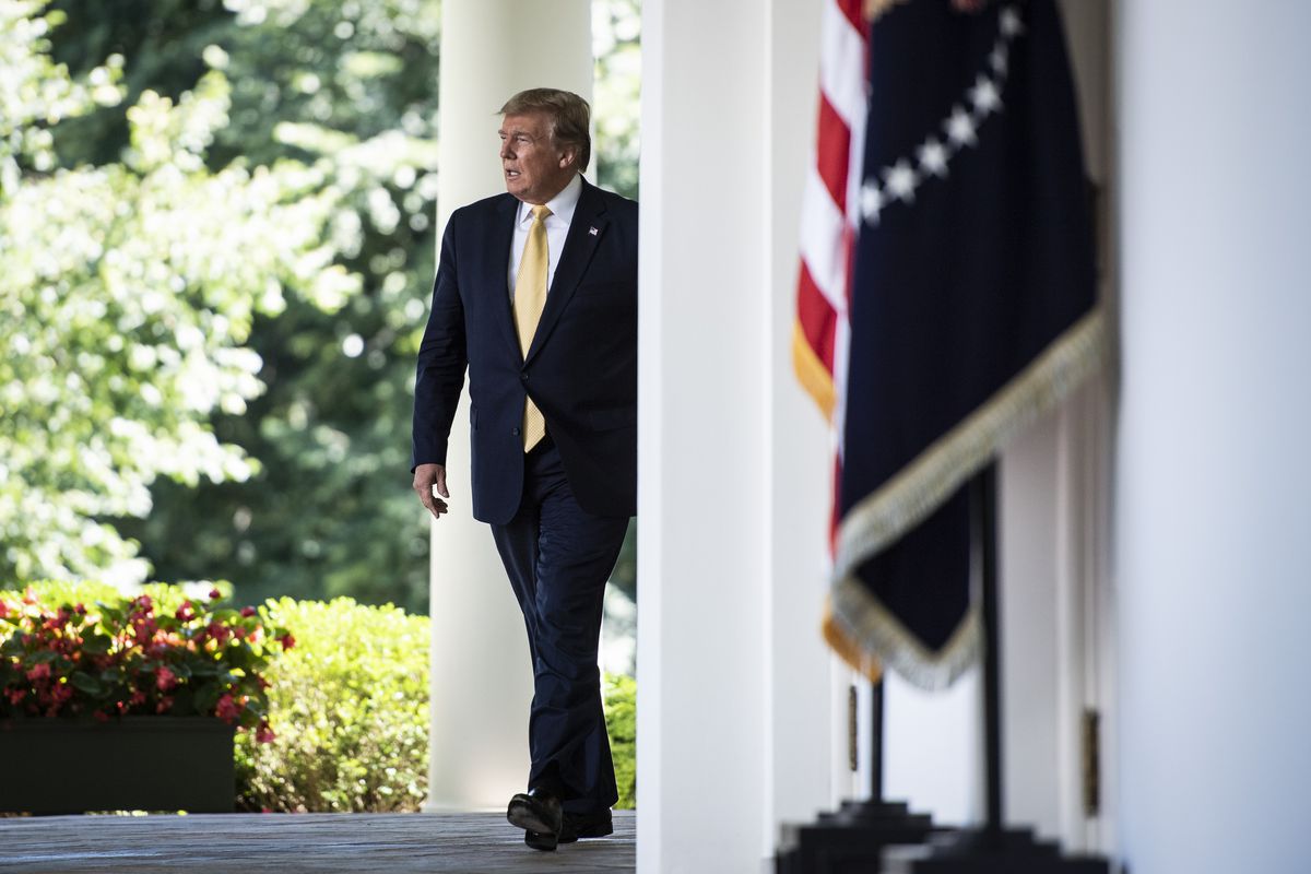 Donald Trump walks to the White House’s Rose Garden. 