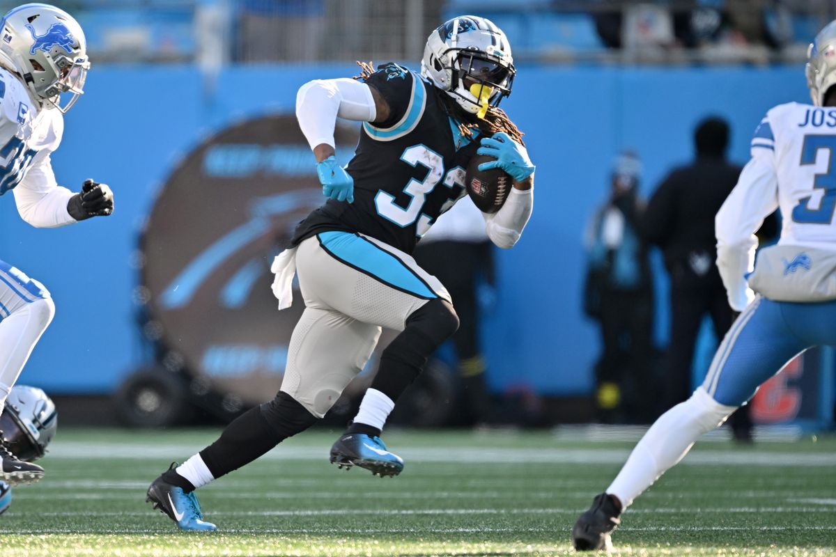 D’Onta Foreman #33 of the Carolina Panthers runs with the ball during the third quarter of the game against the Detroit Lions at Bank of America Stadium on December 24, 2022 in Charlotte, North Carolina.