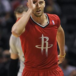 Houston Rockets forward Chandler Parsons celebrates a 3-point basket during the first half of an NBA basketball game against the San Antonio Spurs on Wednesday, Dec. 25, 2013, in San Antonio. 