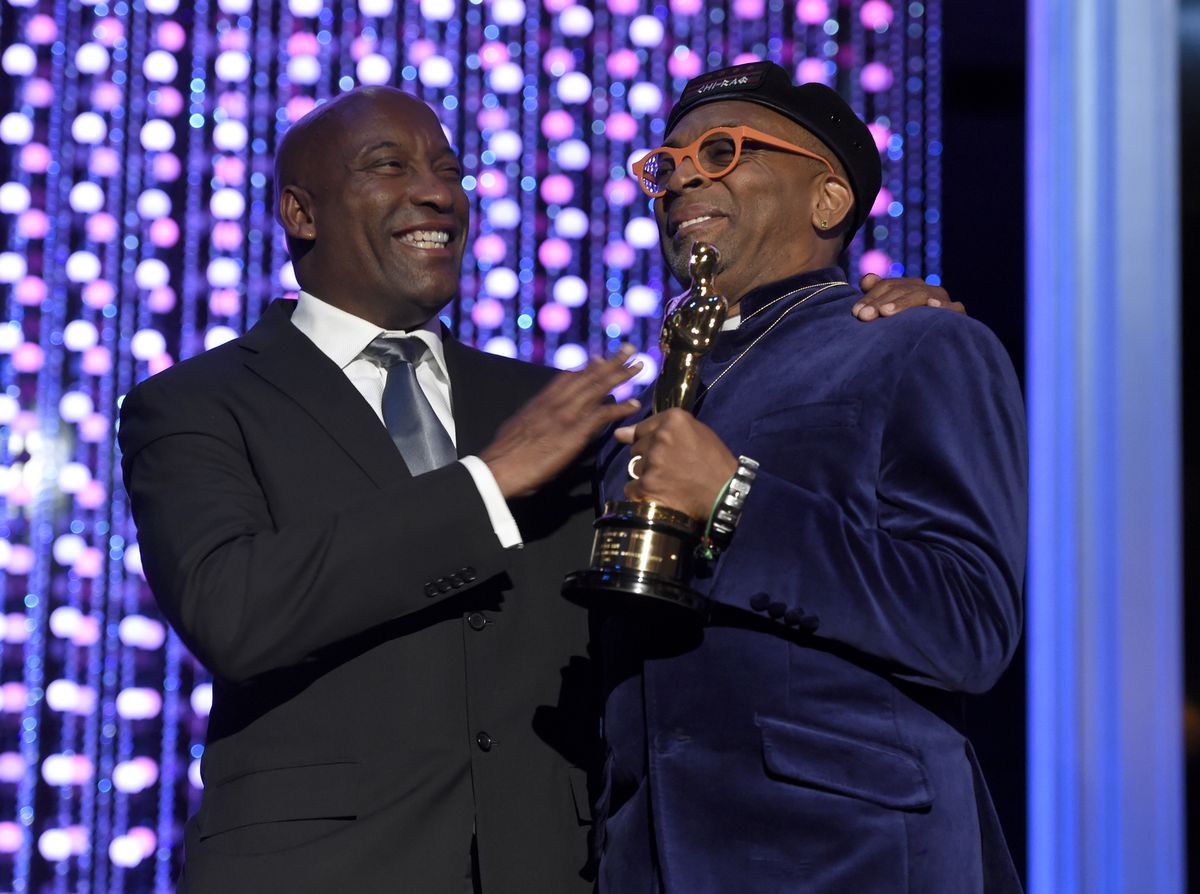 John Singleton (left) congratulates Spike Lee on his receipt of an honorary Oscar in 2015. | Chris Pizzello/Invision/AP