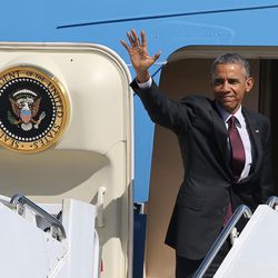 President Barack Obama waves goodbye from Air Force One as he leaves Hill Air Force Base after his first presidential visit to Utah on Friday, April 3, 2015.