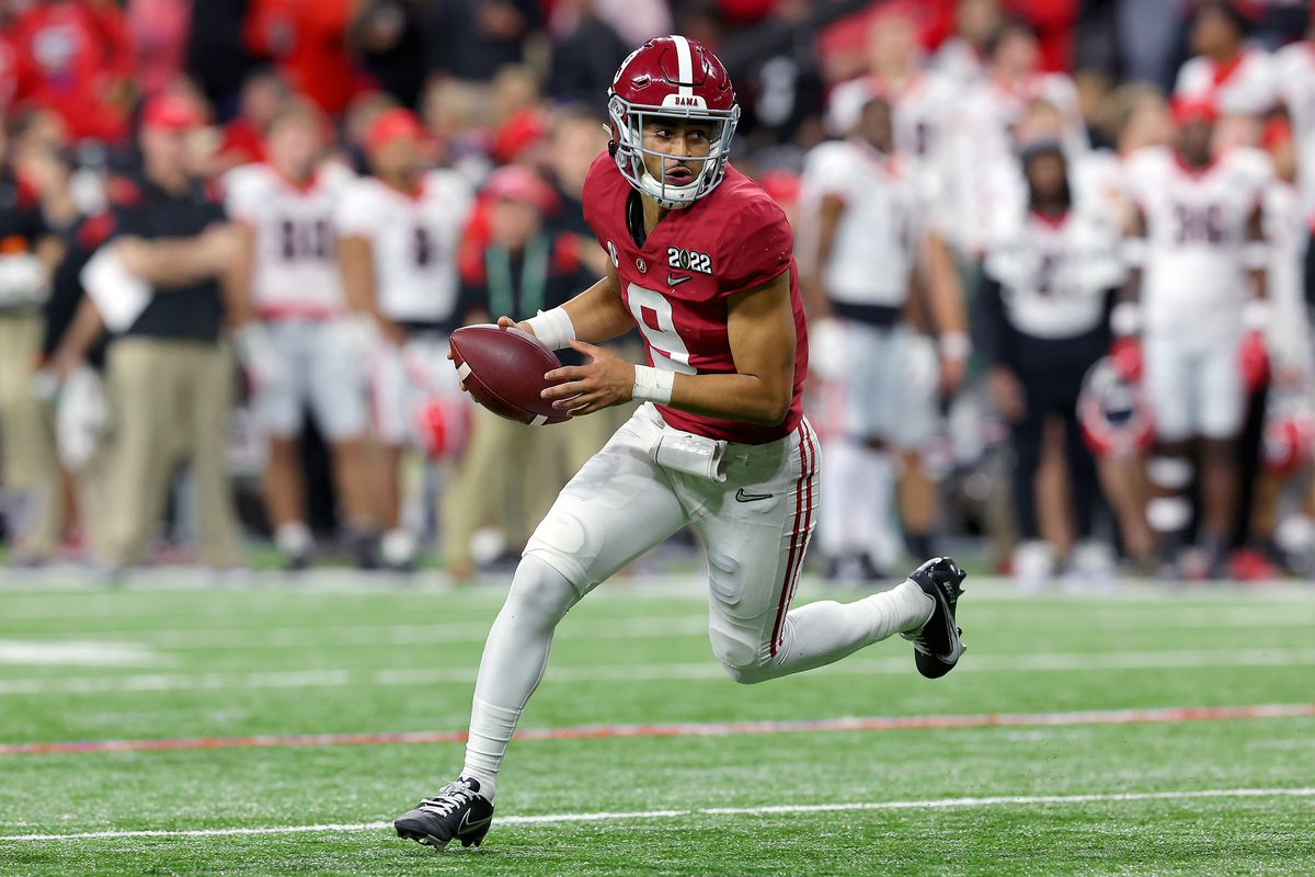 Bryce Young #9 of the Alabama Crimson Tide runs with the ball while trying to make a two point conversion in the fourth quarter of the game against the Georgia Bulldogs during the 2022 CFP National Championship Game at Lucas Oil Stadium
