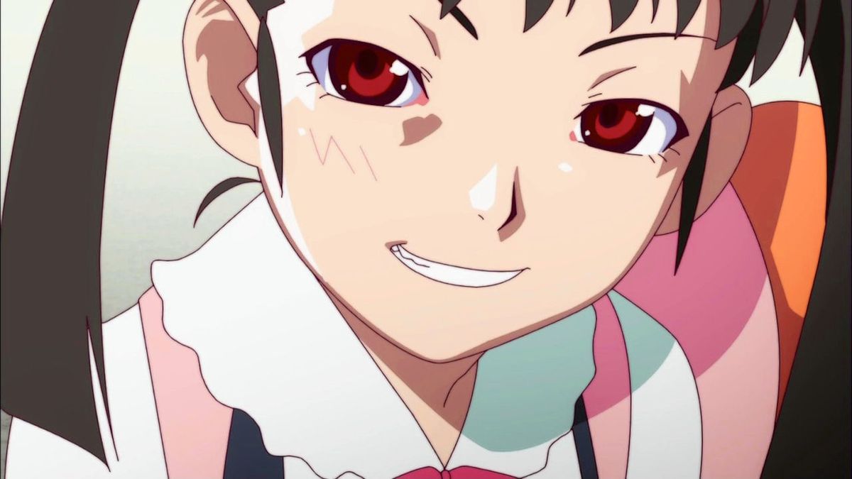 Mayoi from Bakemonogatari, an elementary school student with red eyes and pigtails, smirts at the screen. 