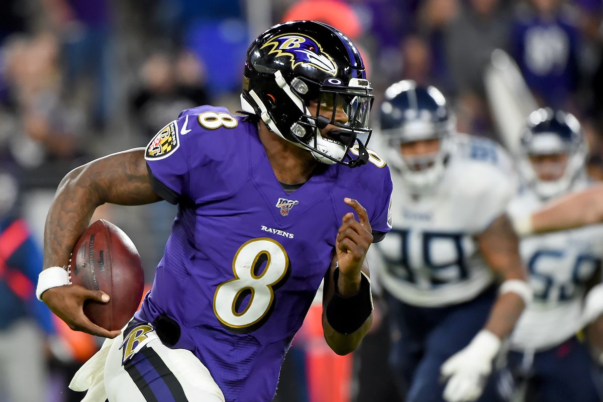 Lamar Jackson #8 of the Baltimore Ravens runs against the Tennessee Titans during the AFC Divisional Playoff game at M&amp;T Bank Stadium on January 11, 2020 in Baltimore, Maryland.