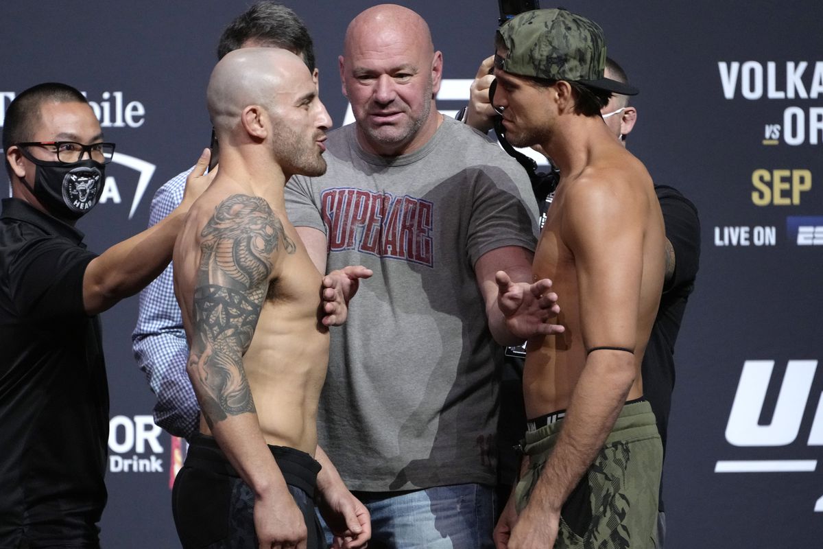 Opponents Alexander Volkanovski of Australia and Brian Ortega face off during the UFC 266 ceremonial weigh-in at Park Theater on September 24, 2021 in Las Vegas, Nevada.
