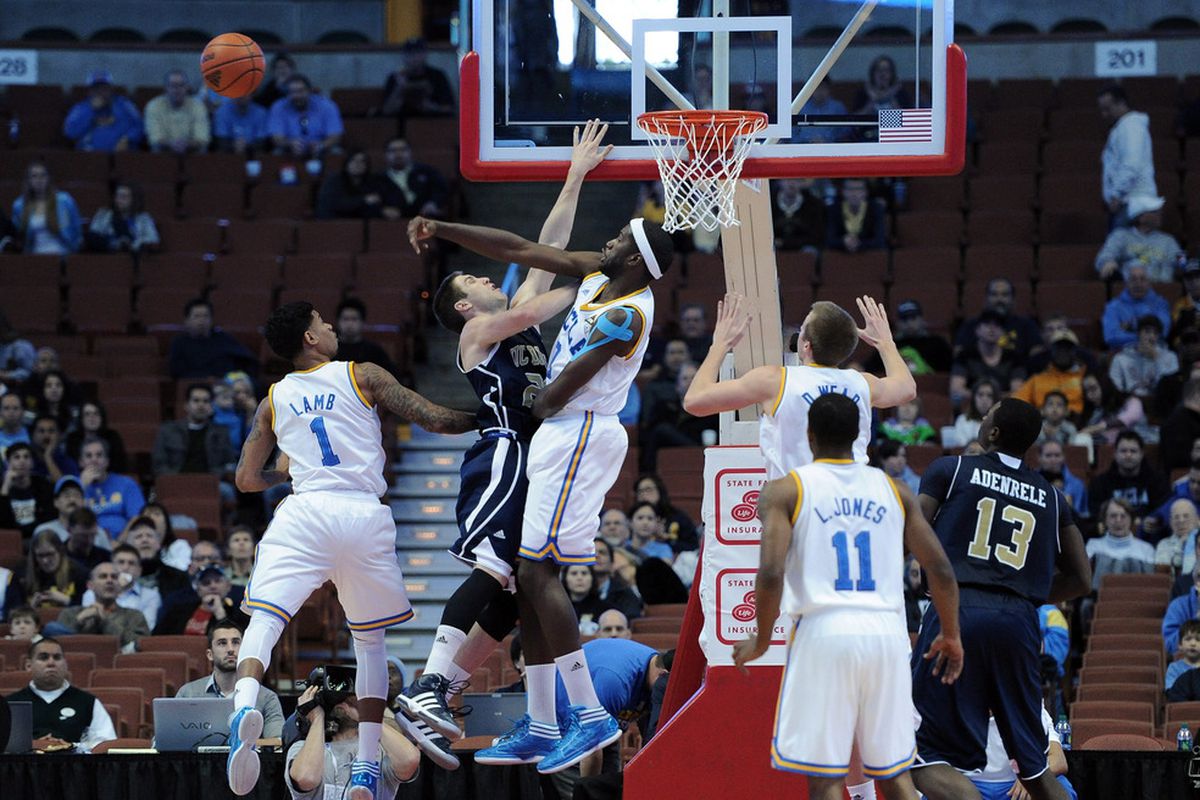 ANAHEIM, CA - DECEMBER 17:  Anthony Stover #0 of the UCLA Bruins blocks the shot of Eddie Miller #21 of the UC Davis Aggies during the first half at Honda Center on December 17, 2011 in Anaheim, California.  (Photo by Harry How/Getty Images)
