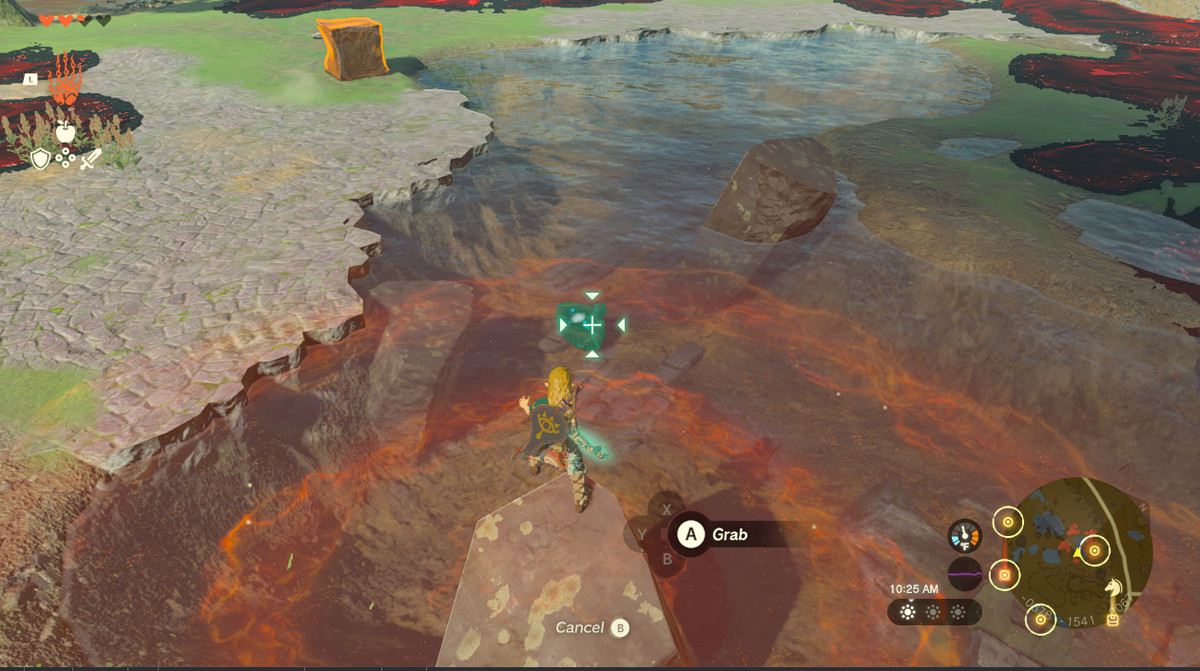 Link pulls a goddess eye out of a river in Zelda Tears of the Kingdom.