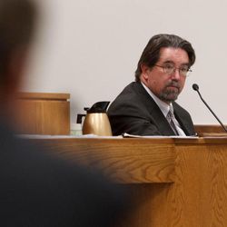 Utah Chief Medical Examiner Dr. Todd Grey testifies as the trial for Martin MacNeill continues in 4th District Court in Provo, Thursday, Oct. 31, 2013. MacNeill is accused of murder for allegedly killing his wife, Michele MacNeill, in 2007.