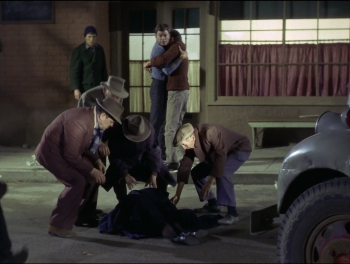 Edith Keeler dying in the street in a still from The Original Series of Star Trek