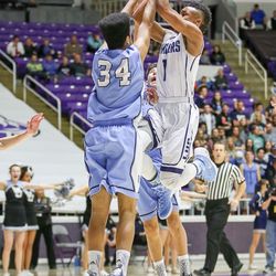 Layton's Julian Blackmon (1) finished the drive down the lane as West Jordan's Darrian Nebeker (34) applies the tight defense at the Class 5A State basketball tournament Tuesday, March 1, 2016, at Weber State. Layton advances with a solid 54-38 win over West Jordan.