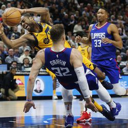 LA Clippers forward Blake Griffin fouls Utah Jazz guard Alec Burks during NBA action in Salt Lake City on Saturday, Jan. 20, 2018.