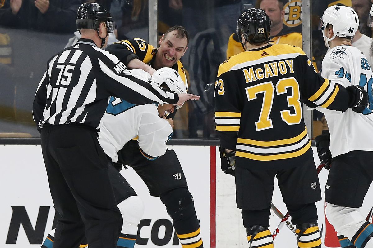 Feb 26, 2019; Boston, MA, USA; Boston Bruins defenseman Zdeno Chara (33) fights with San Jose Sharks left wing Evander Kane (9) during the third period at TD Garden.