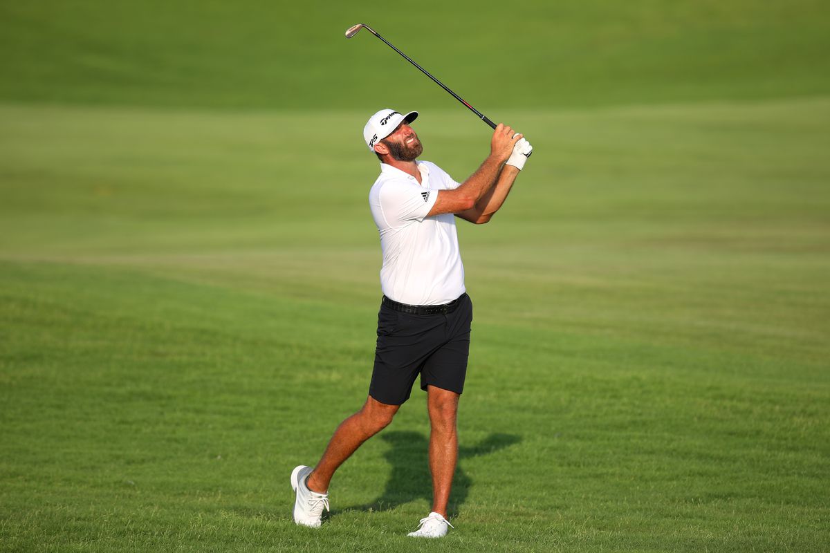 Dustin Johnson of 4 ACES GC plays his second shot on the first hole during day three of the LIV Golf Invitational - Jeddah at Royal Greens Golf &amp; Country Club on October 16, 2022 in King Abdullah Economic City, Saudi Arabia.
