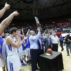 Bingham players celebrate their 61-44 win over Copper Hills in the 5A basketball championship in the Huntsman Center at the University of Utah Saturday, March 5, 2016. 
