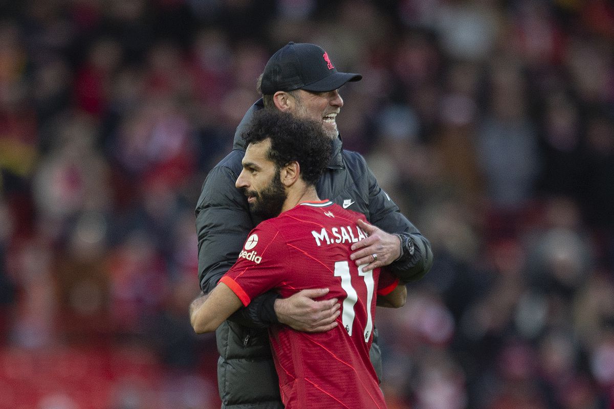 Liverpool manager Jurgen Klopp embraces Mohamed Salah of Liverpool in action during the Premier League match between Liverpool and Norwich City at Anfield on February 19, 2022 in Liverpool, United Kingdom.