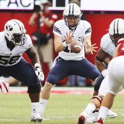 BYU quarterback Tanner Mangum takes a snap against Nebraska in Lincoln, Neb., Saturday, Sept. 5, 2015. BYU won 33-28 on Mangum’s Hail Mary touchdown pass on the game’s final play.