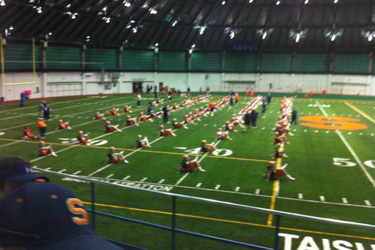Syracuse warms up for their first spring practice of 2011 in newly renovated Manley Field House.