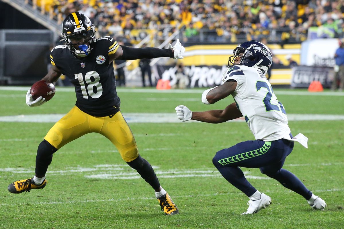 Pittsburgh Steelers wide receiver Diontae Johnson (18) runs past Seattle Seahawks cornerback Tre Brown (22) after a catch during the third quarter at Heinz Field. Pittsburgh won 23-20 in overtime.&nbsp;