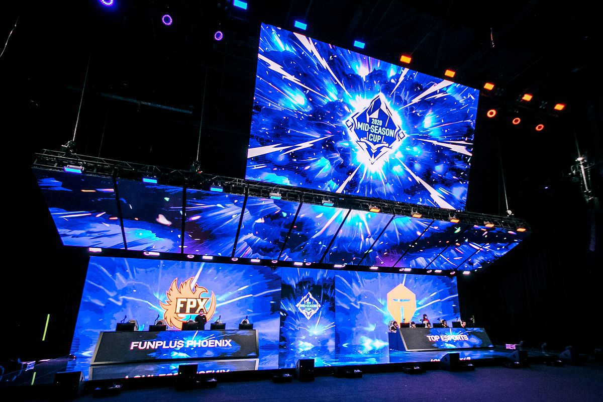 League of Legends Pro League teams FunPlus Phoenix (L) and Top Esports (R) compete during the League of Legends Mid-Season Cup finals at the LPL Arena on May 31.