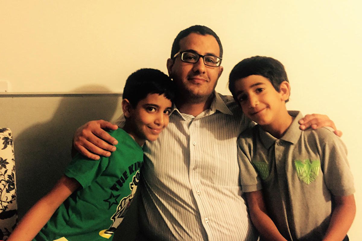 Nadim al-Sakkaf with his two children before the arrest in August.