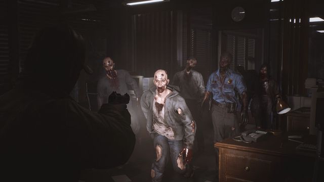 A player character aims at a group of zombies in a dark room in a screenshot from The Day Before