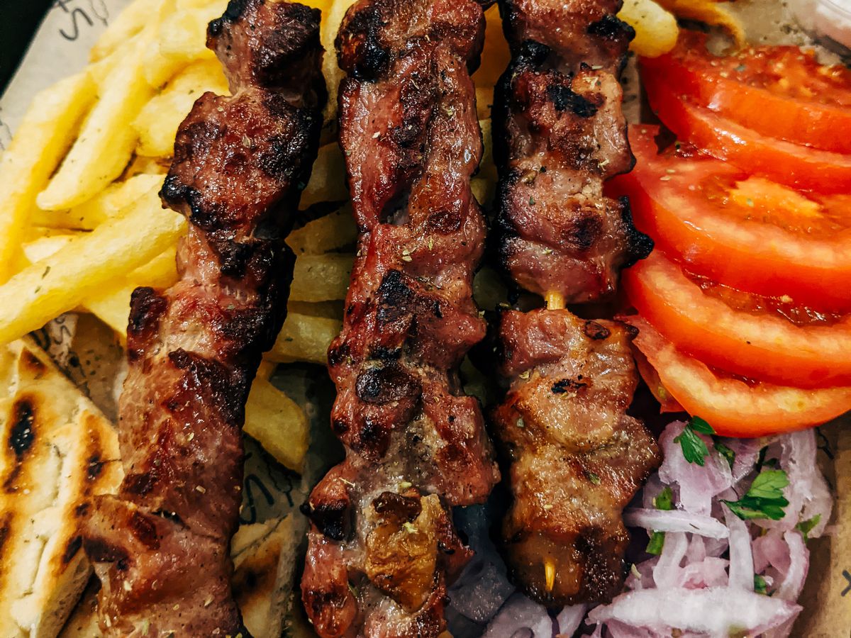 kebabs on French fries.