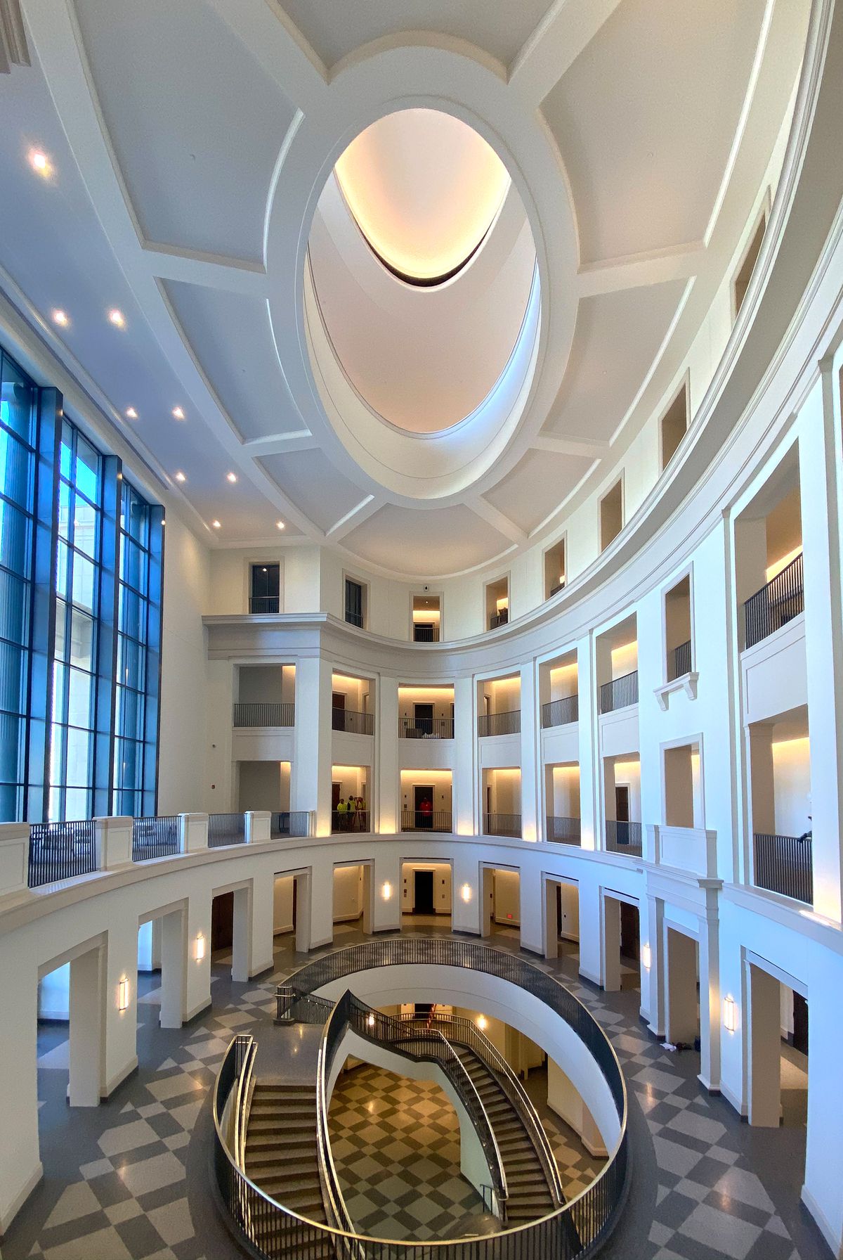 A rounded atrium ascends five floors. 