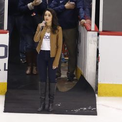 Gina Salvatore sings the national anthem before the UConn men’s hockey game.