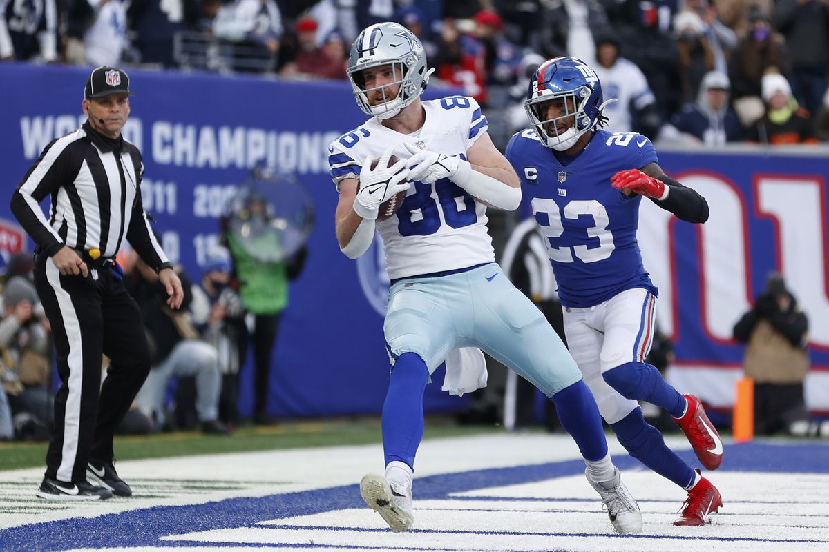 Dalton Schultz #86 of the Dallas Cowboys catches the ball for a touchdown in front of Logan Ryan #23 of the New York Giants during the third quarter at MetLife Stadium on December 19, 2021 in East Rutherford, New Jersey.