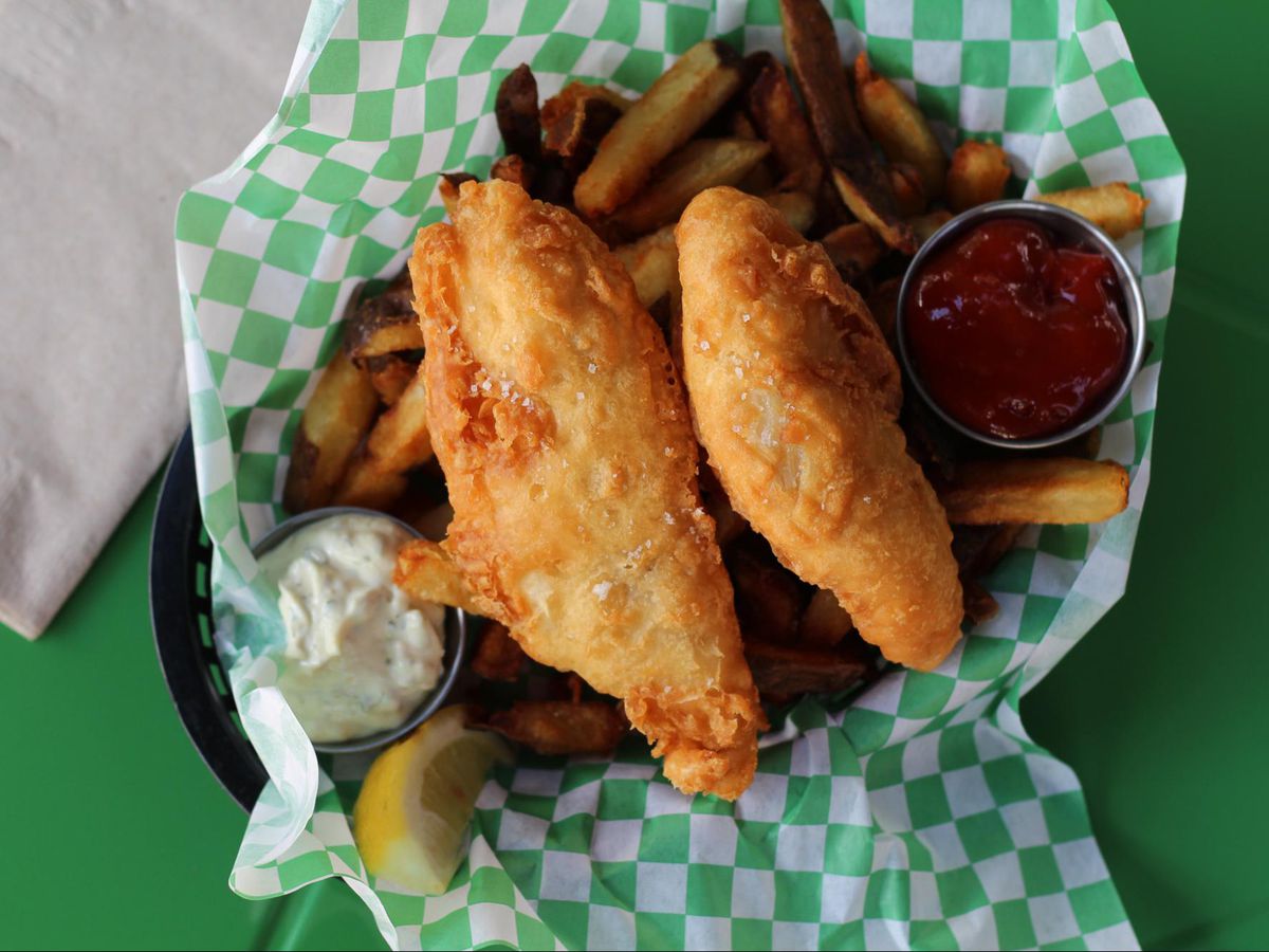 Two pieces of beer-battered fish and fries.