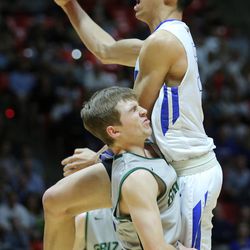 Bingham's Samuta Avea (32) crashes into Copper Hills's Trevor Hoffman (2) as Bingham and Copper Hills play for the 5A basketball championship in the Huntsman Center at the University of Utah Saturday, March 5, 2016. Bingham won 61-44.