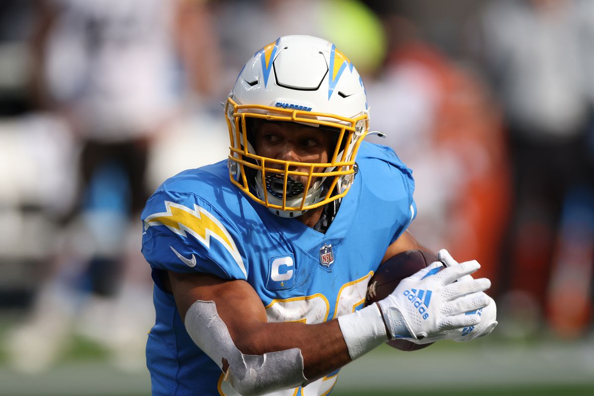 Austin Ekeler #30 of the Los Angeles Chargers carries the ball during a 47-42 win over the Cleveland Browns at SoFi Stadium on October 10, 2021 in Inglewood, California.