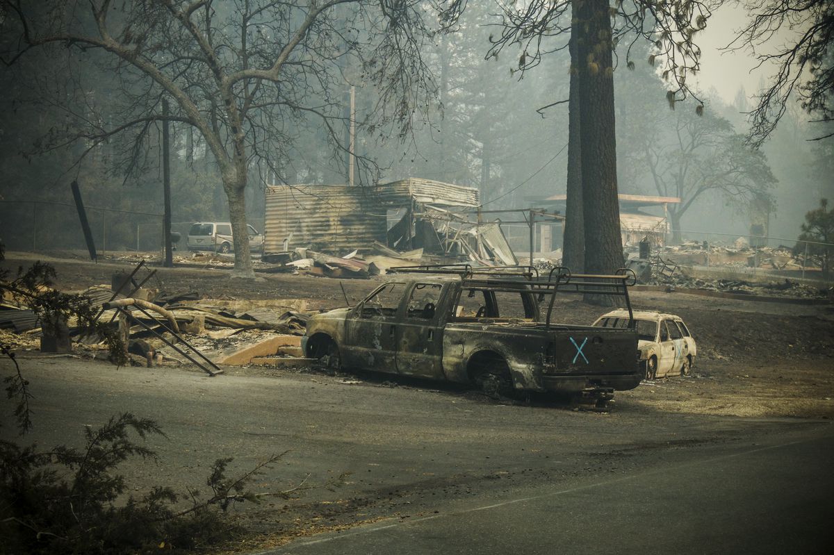 Burned out vehicles were scattered in streets and driveways in Paradise, California after the Camp Fire destroyed most of the town.