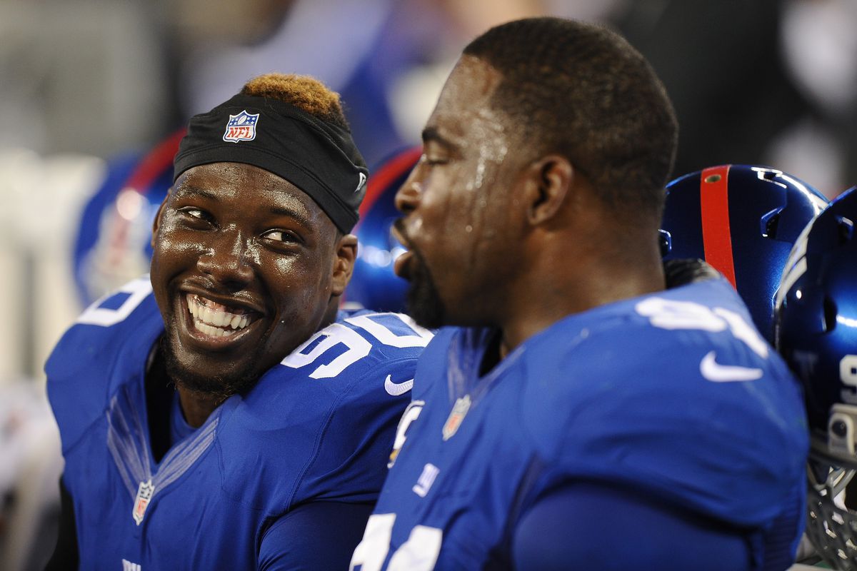 Jason Pierre-Paul and Justin Tuck talk in the fourth quarter