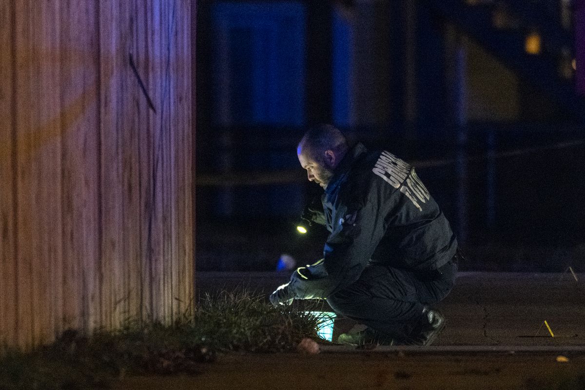 Chicago police work the scene where a person was shot in the 9200 block of S. Phillips Ave. in the Calumet Heights neighborhood, Monday, Dec. 27, 2021.