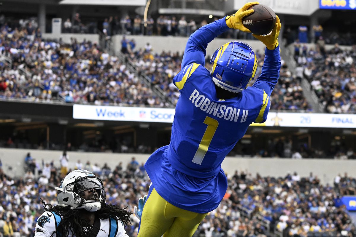 Allen Robinson II #1 of the Los Angeles Rams catches a touchdown pass over Donte Jackson #26 of the Carolina Panthers in the second quarter of a game at SoFi Stadium on October 16, 2022 in Inglewood, California.