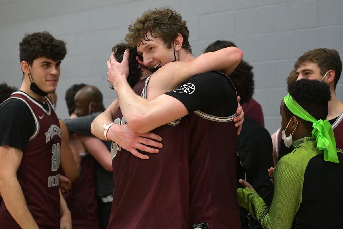 WORCESTER - TJ Power hugs his teammate after the win. NEPSAC Class AA boys’ basketball championship between Worcester Academy and Bradford Christian Academy Sunday, March 6, 2022. The final score was Worcester Academy 85, Bradford Christian 83. Spo Worcester Academy 6