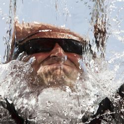 Officer Jeremy Barnes dumps a bucket of water on his head during the the Utah Law Enforcement Memorial Ice Water Challenge at Draper Historic Park, Wednesday, Sept. 3, 2014. One bucket of ice water was dumped on an officer's head for each of the 137 officers who have been killed in the line of duty in Utah.
