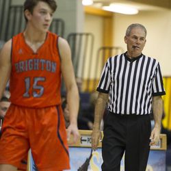 Basketball official Ken Sowby eyes a defender during a UHSAA basketball game between Brighton and Skyline in Salt Lake City on Wednesday, Dec. 7, 2016.