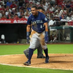 Aug 15, 2022; Anaheim, California, USA; Seattle Mariners center fielder Julio Rodriguez (44) celebrates after scoring in the ninth inning against the Los Angeles Angels at Angel Stadium. Mandatory Credit: Kirby Lee