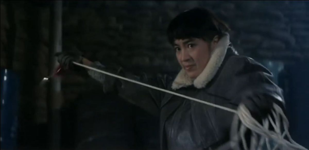Michelle Yeoh with a rope dart in Magnificent Warriors.