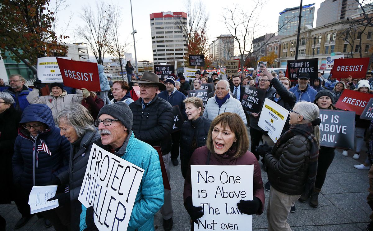 Protesters rally in Salt Lake City on Thursday, Nov. 8, 2018, following the resignation of Attorney General Jeff Sessions. At front are Stephen Trimble and Nancy Olson.