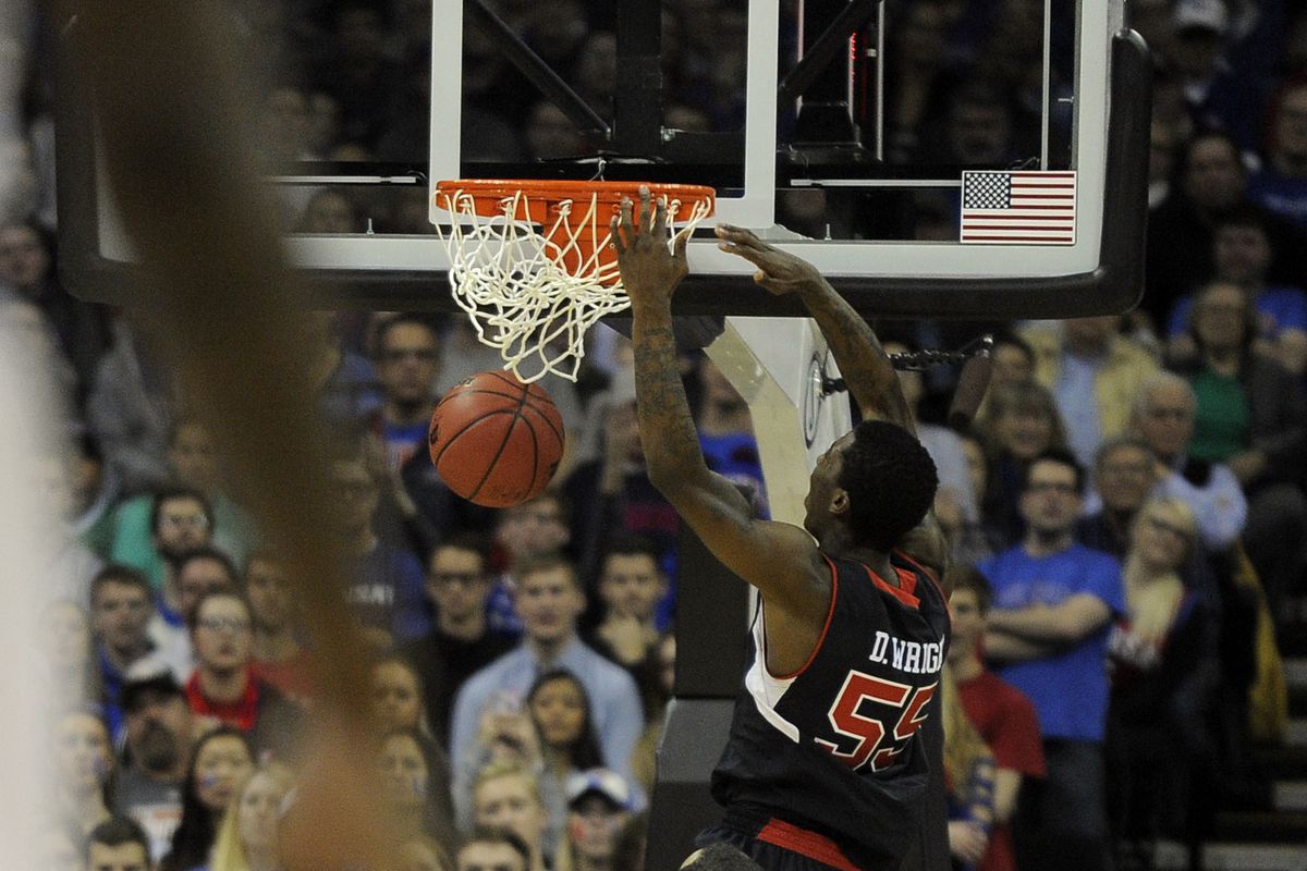Utah point guard Delon Wright dunks at Kansas on his way to being named Pac-12 Player of the Week.