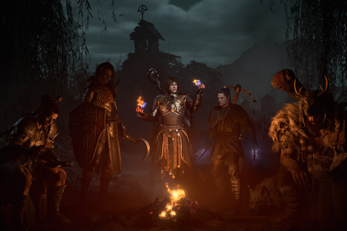Character creator in Diablo 4 / IV. All of the characters, barbarian, necromancer, sorcerer, rogue, and druid, sat in front of a campfire at night.
