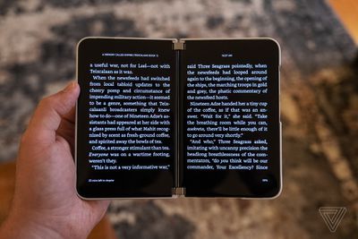A Kindle e-book spanned across both screens of the Microsoft Surface Duo 2