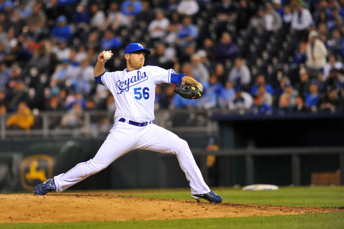 April 16, 2012; Kansas City, MO, USA; Kansas City Royals relief pitcher Greg Holland (56) delivers a pitch in the ninth inning against the Detroit Tigers at Kauffman Stadium. Detroit won 3-2. Mandatory Credit: Denny Medley-US PRESSWIRE
