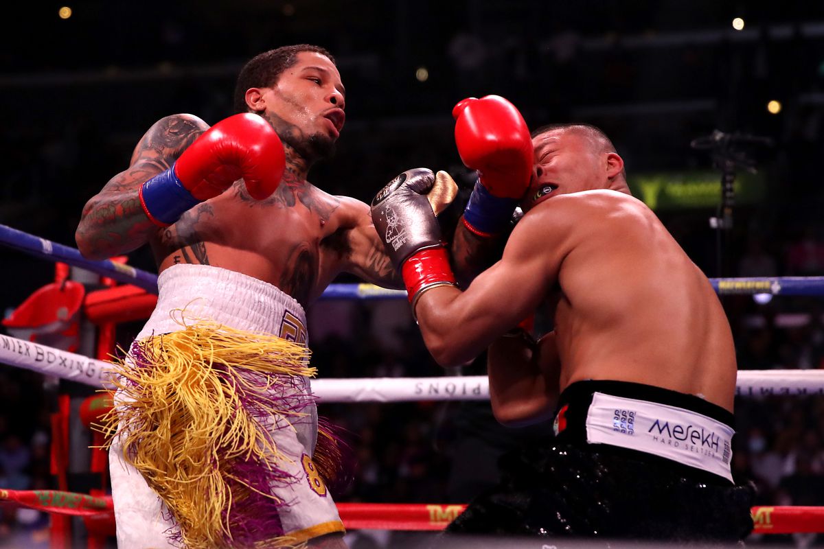 Gervonta Davis lands a left uppercut on challenger Isaac Cruz during their WBA title fight.