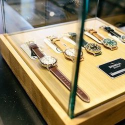 Accessories include watches from Shinola Detroit.